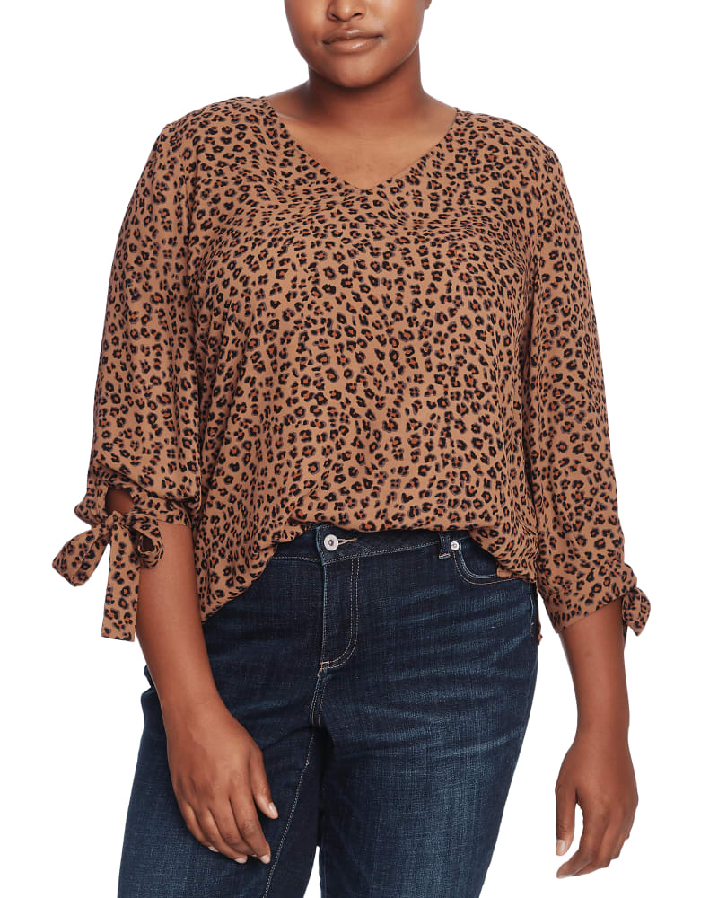 Front of a model wearing a size 1X Taylor Animal-Print Tie-Sleeve Top in SPICEWOOD by CeCe. | dia_product_style_image_id:263819